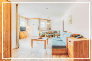 Televízia a/alebo spoločenská miestnosť v ubytovaní Gäste-Appartementhaus - Urlaubsresort Hafele