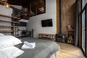 a bedroom with a bed and a fire place at Apart-hotel Vershina in Yaremche