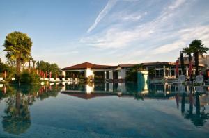 a pool of water in front of a building at Hotel Garden Terme in Montegrotto Terme