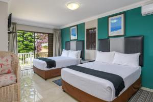 מיטה או מיטות בחדר ב-Sada Boutique Hotel