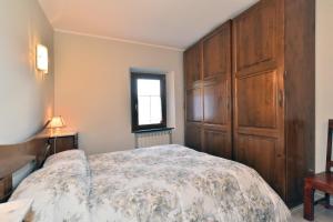 Ένα ή περισσότερα κρεβάτια σε δωμάτιο στο La Casetta Della Nonna