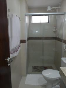 a bathroom with a shower with a toilet and a sink at Apartamento Condomínio Sonhos da Serra - Bananeiras in Bananeiras