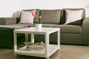 a white coffee table in a living room with a couch at Bungalow Elegance in Maspalomas