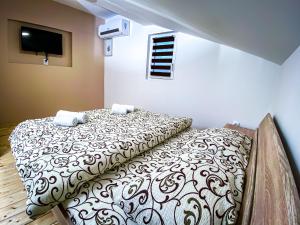 Postel nebo postele na pokoji v ubytování Kiko apartmani