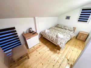 Postel nebo postele na pokoji v ubytování Kiko apartmani