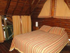 En eller flere senge i et værelse på Bosques del Este