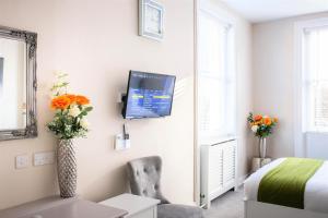 A television and/or entertainment center at St Johns Boutique Hotel 