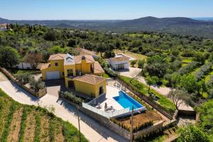 an aerial view of a villa with a swimming pool at Sunny House in Loulé