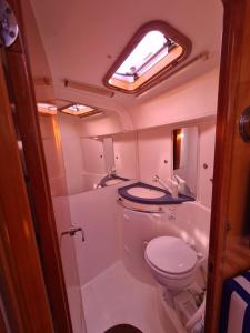 a small bathroom with a toilet and a sink at BARCO PURAVIDA in Vigo +17 photos