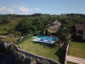 an aerial view of a swimming pool in a yard at hacienda del mar in Río San Juan