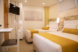 Postel nebo postele na pokoji v ubytování Hotel Silver Guarne