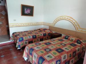 Rúm í herbergi á Posada Los Naranjos