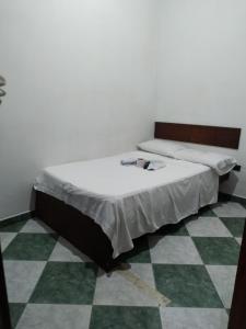 Postel nebo postele na pokoji v ubytování Hotel Policarpa