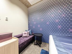 Hotel Musse Kyoto Shijo Kawaramachi Meitetsu客房内的一张或多张床位