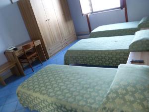 A bed or beds in a room at Ancelle Sorrento - Casa d'Accoglienza