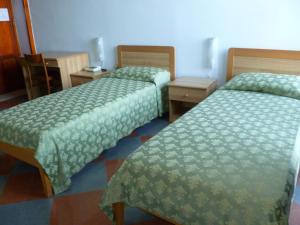 A bed or beds in a room at Ancelle Sorrento - Casa d'Accoglienza