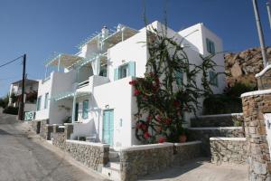 a row of white houses on a street at Villa Meliti in Platis Gialos