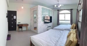 Postel nebo postele na pokoji v ubytování Sea Man Homestay