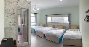 Postel nebo postele na pokoji v ubytování Sea Man Homestay