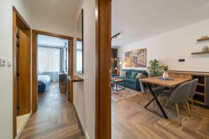 a small apartment with a dining room and a living room at INCANTO Apartment in Ruse +21 photos