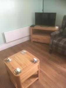 a living room with a couch and a coffee table at Brentwood in Beverley