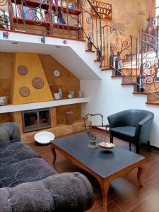 a living room with a couch and a table at La Casona Canaria Boutique Home B & B in Agüimes