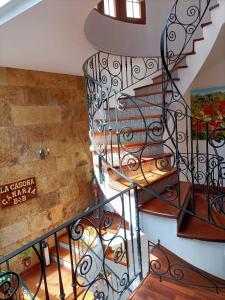 a spiral staircase in a home with wooden flooring at La Casona Canaria Boutique Home B & B in Agüimes
