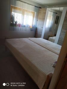 Tempat tidur dalam kamar di Seosko turističko domaćinstvo MILKA