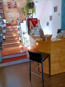 a store with a counter and a chair in a room at La Casona Canaria Boutique Home B & B in Agüimes