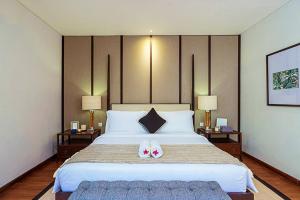 Tempat tidur dalam kamar di Nusa Dua Bayview