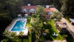 an aerial view of a house with a swimming pool at Candy Apart Hotel in Villa General Belgrano