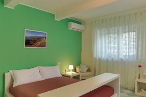 Ένα ή περισσότερα κρεβάτια σε δωμάτιο στο B&B Porta Della Sicilia