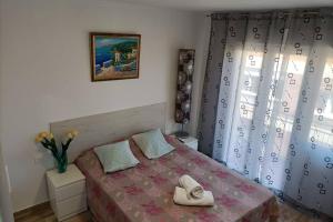 A bed or beds in a room at Apartamento 5 minutos hasta la playa
