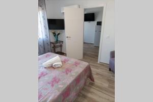 A bed or beds in a room at Apartamento 5 minutos hasta la playa