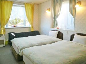 Gallery image of ペンション百万本のバラ "A Million Roses" in Shimoda