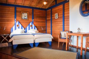 מיטה או מיטות בחדר ב-O Zimbreiro