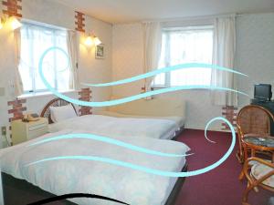 Gallery image of ペンション百万本のバラ "A Million Roses" in Shimoda