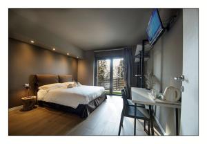A bed or beds in a room at Il Rifugio del Risol
