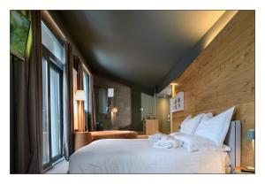 A bed or beds in a room at Il Rifugio del Risol