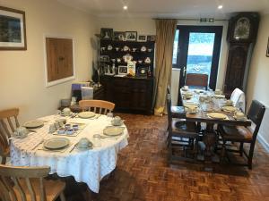 a dining room with a table and chairs at Stoke House Bed and Breakfast in Stoke Rivers