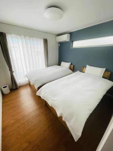 Ένα ή περισσότερα κρεβάτια σε δωμάτιο στο Shonan 4BR entire house&parking,戸建て独占R&L House
