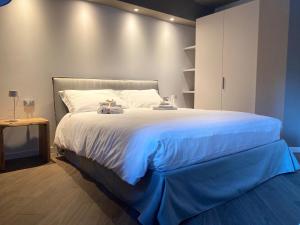 A bed or beds in a room at Il Rifugio del Risol
