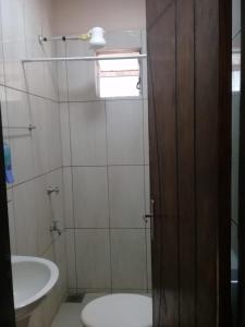 a bathroom with a toilet and a sink at Ciudad del Este - Departamento amoblado in Ciudad del Este