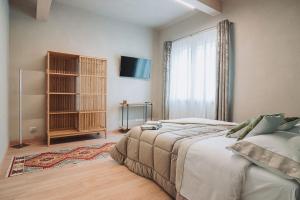 a bedroom with a large bed and a window at B&B CAVOUR 117 in Porto SantʼElpidio