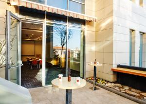 a restaurant with a table in front of a building at Ibis Istanbul Esenyurt in Istanbul