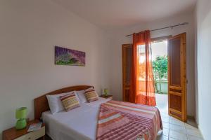 En eller flere senge i et værelse på Residence Tre Palme - Localo