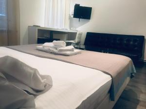 Postel nebo postele na pokoji v ubytování Garni hotel King