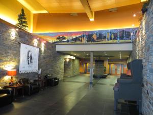a large building with a clock on the wall at Stoney Nakoda Resort & Casino in Seebe