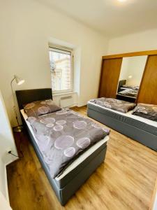 Łóżko lub łóżka w pokoju w obiekcie Abschalten im Zentrum von Bad Ischl