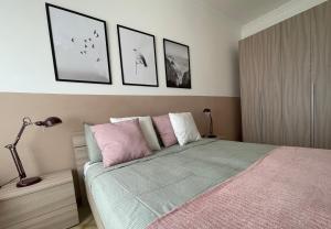 Posteľ alebo postele v izbe v ubytovaní A&B Homes Leuca